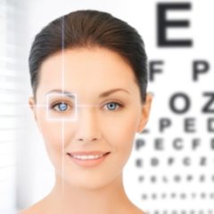 Woman in front of an eye chart