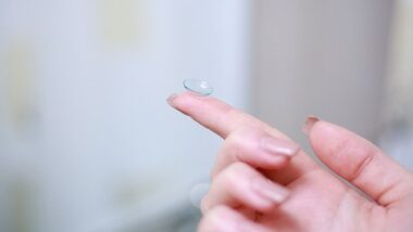 Contact lens on finger